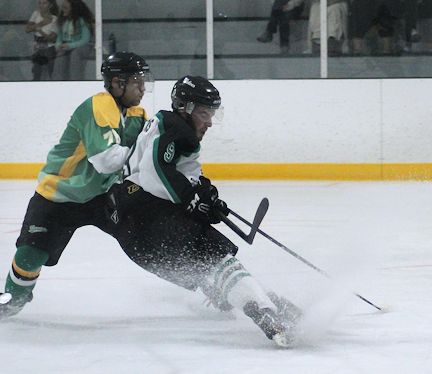 Drew Davidson (right) of the Ripley Wolves rushes the Huron East net, hoping for a rebound, Friday night at the season home opener; photos by David Dadson